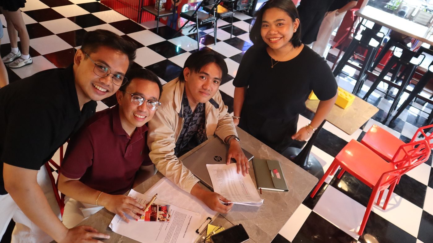The Davao team gathered around a table at Pixel Diner